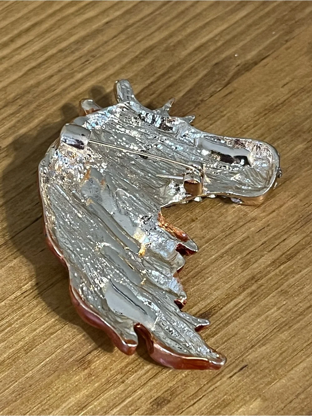 None this brooch